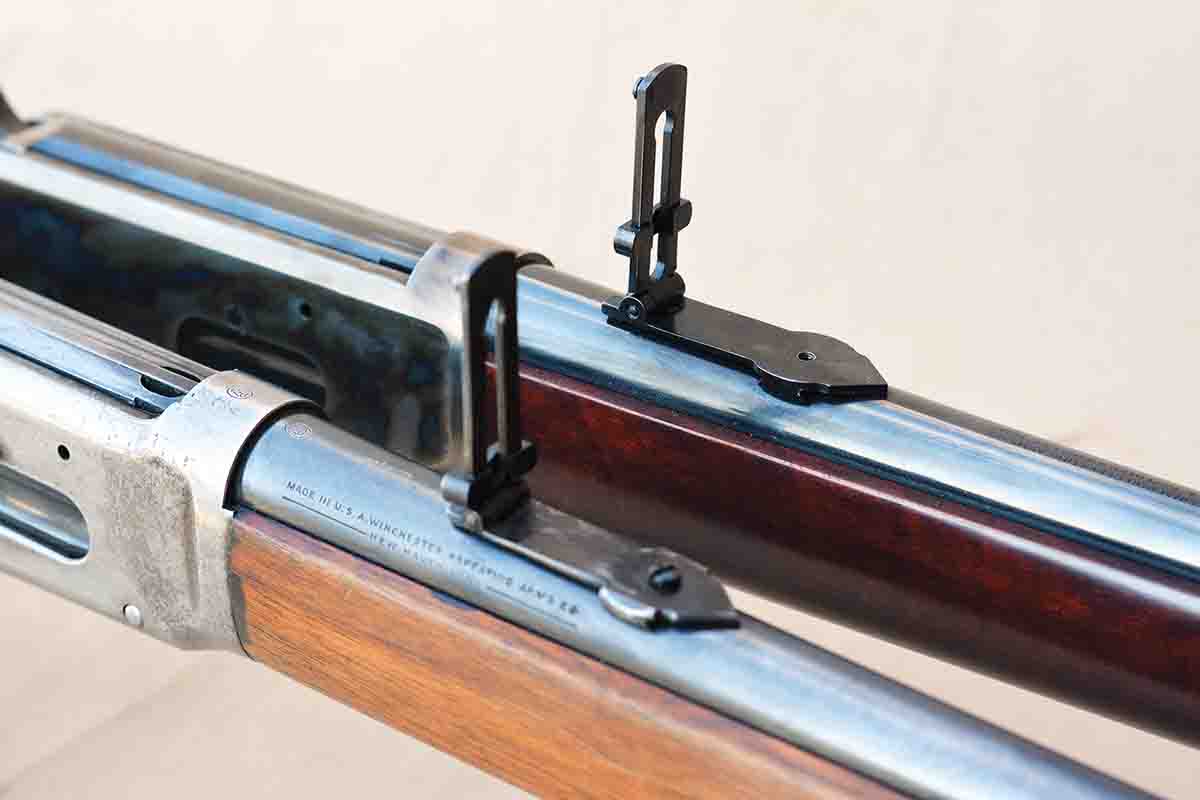 The carbine features a stand-up ladder rear sight (top) that is similar to the original Winchester Model 1894 carbine (bottom).